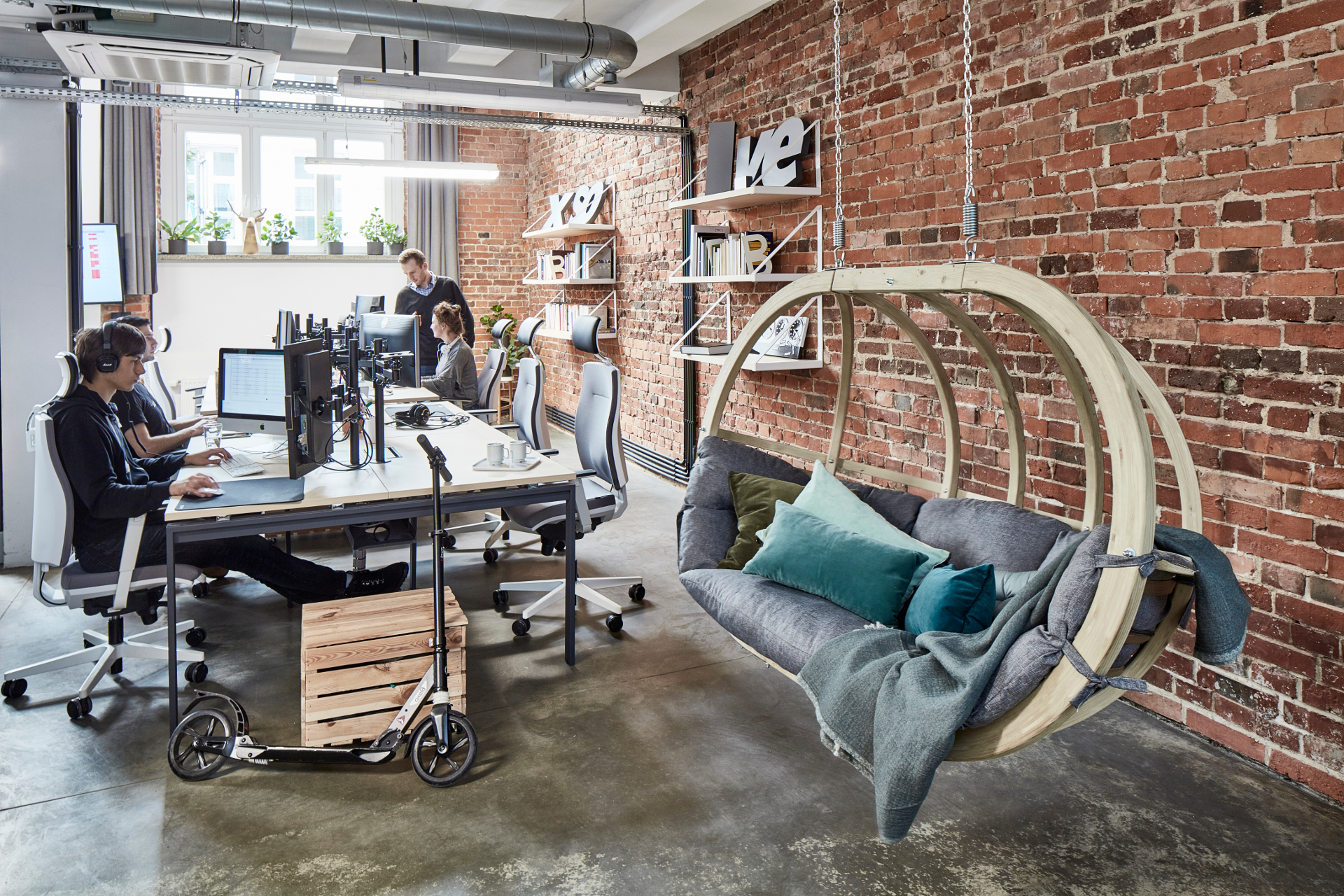 Wooden swing with open space office in background