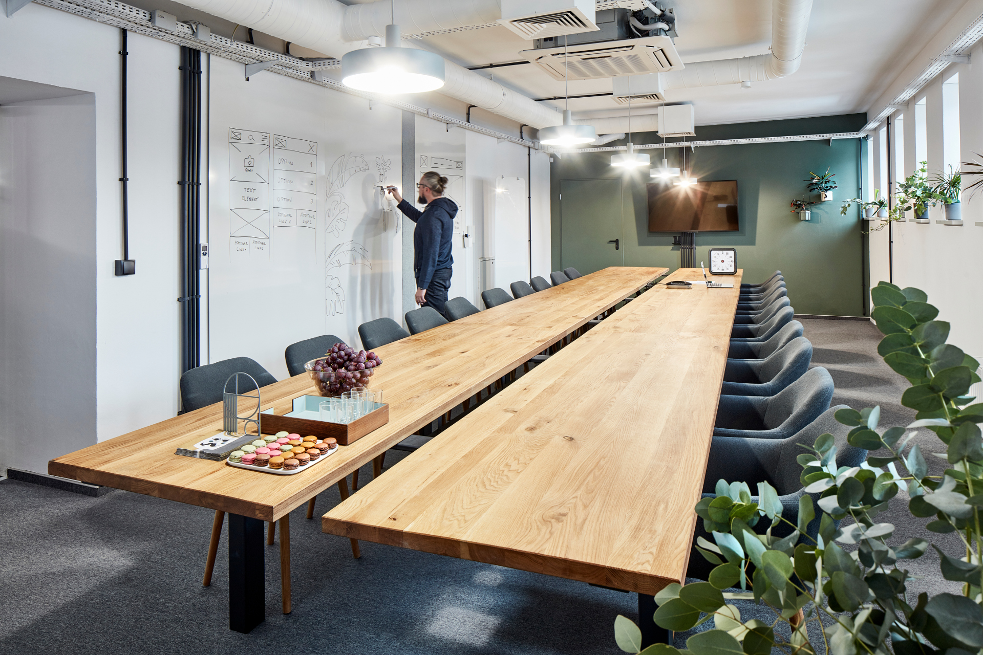 A man writing on the board in conference room